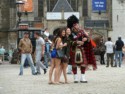 Not sure why there is a Scottish piper in Amseterdam